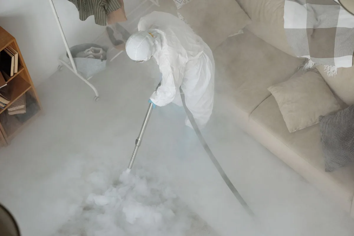 Biohazard cleanup technician in protective equipment, Solvay, NY